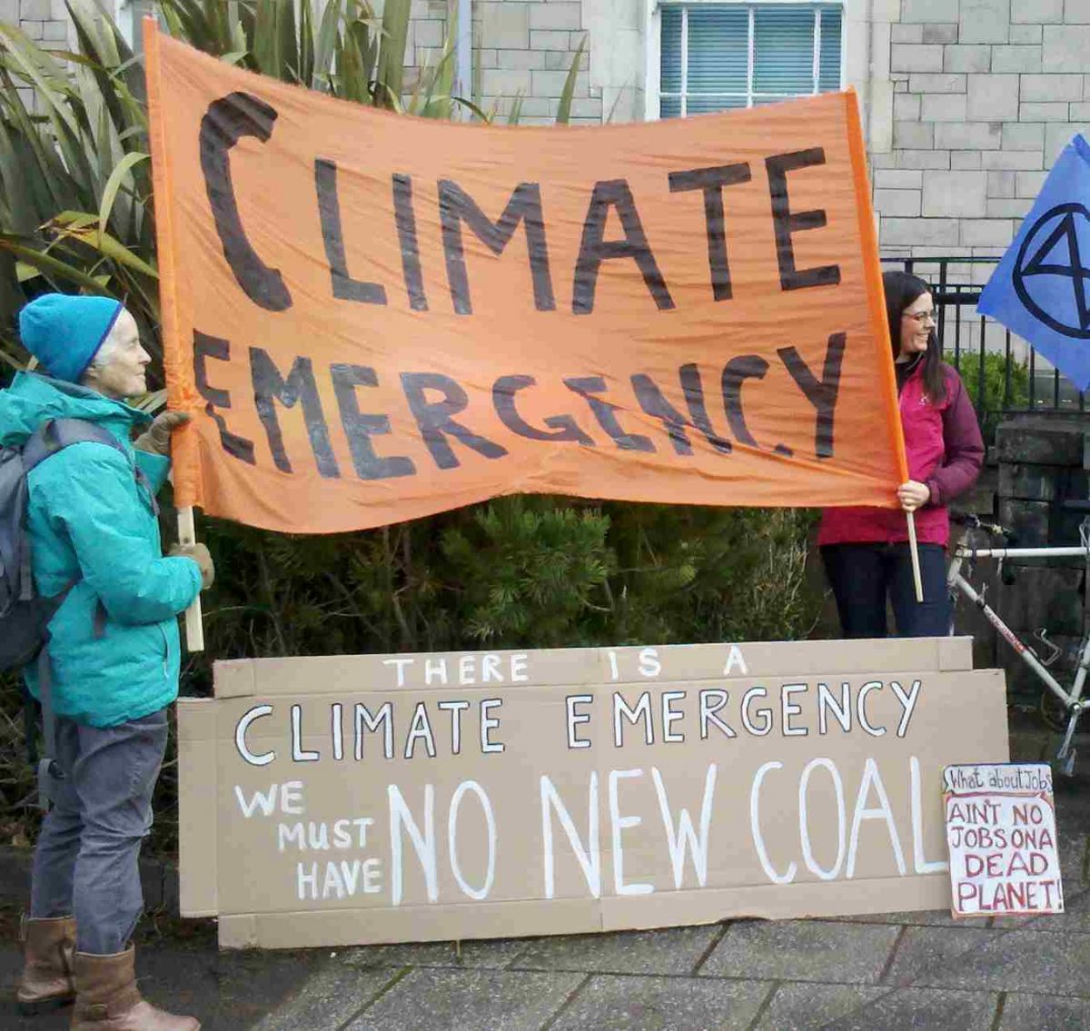 Image shows banners: "There is a Climate Emergency: We must have no new coal"